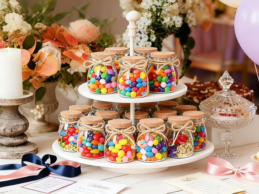 Pudding-style glass jars arranged on a wedding favor display; candy and props are not included
